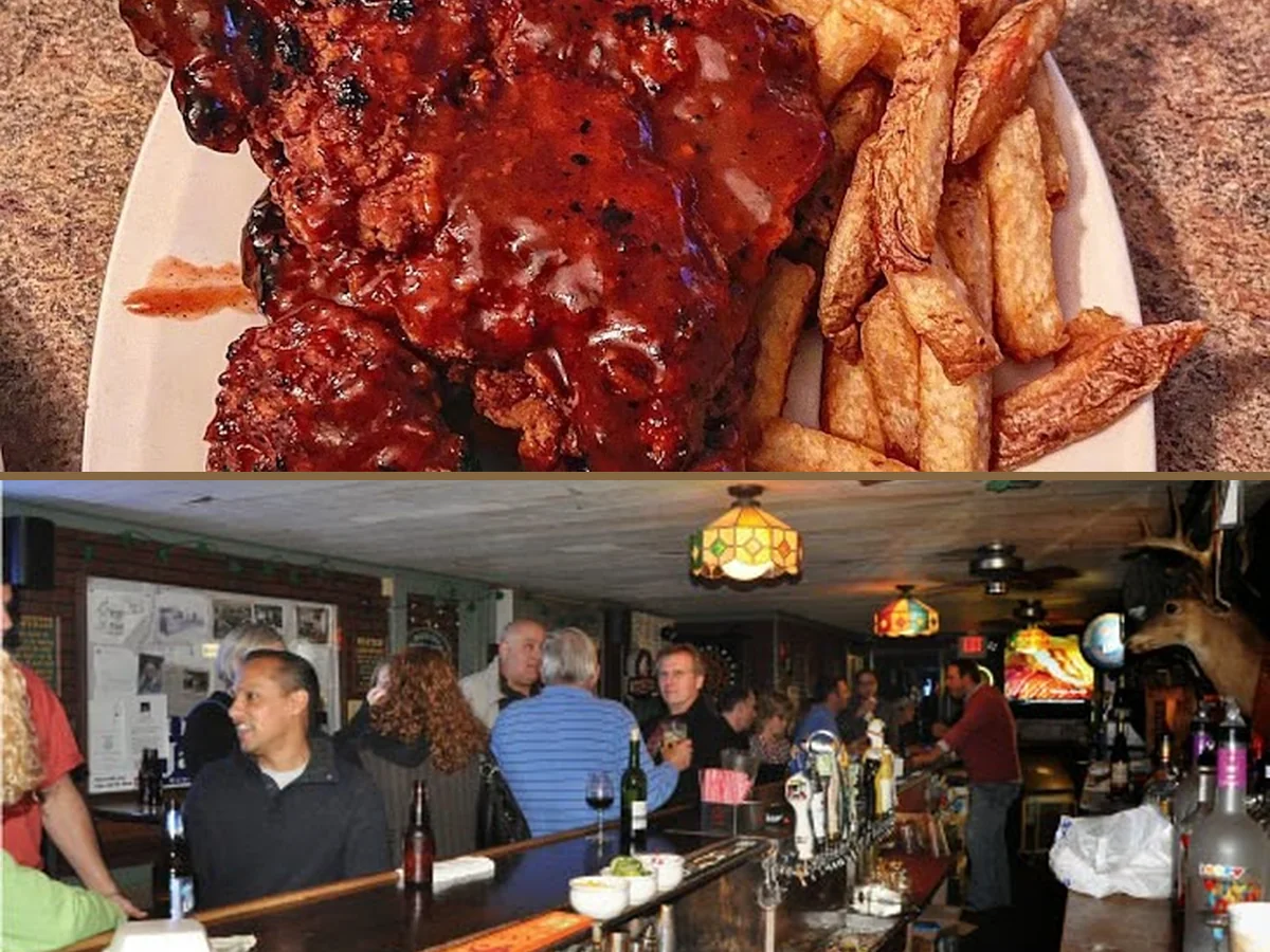 Sports bar interior with TVs and a long counter.